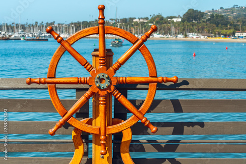 Wooden Ship Steering Wheel on a Pier