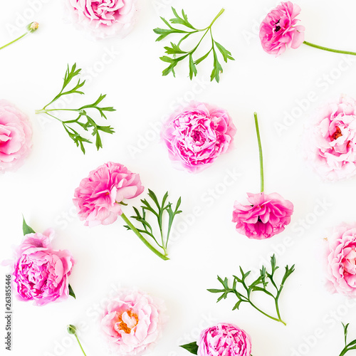 Floral composition with pink flowers on white background. Flat lay