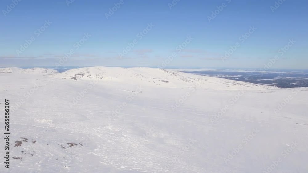 Aerial shot over mountain top during winter. Shot was done in Grätåvallen in Sweden Aerial shot over mountain top during winter. Shot was done in Grätåvallen in Sweden