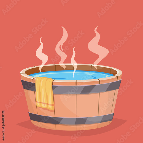 Wooden hot tub and towel