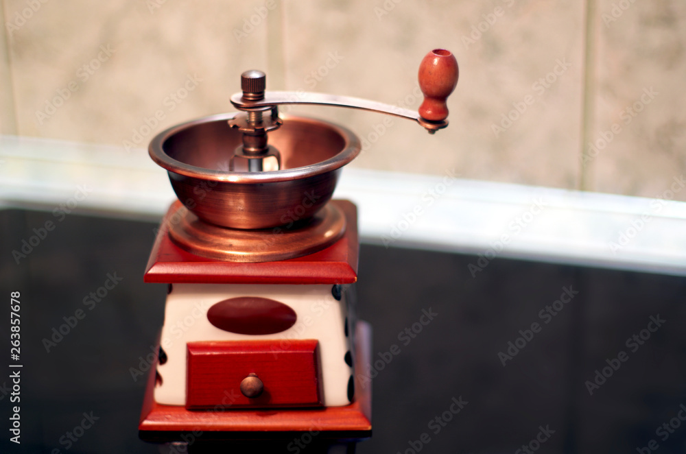 Copper And Wooden Hand Coffee Grinder In The Kitchen. Copper And Wooden Hand Coffee Grinder In The Kitchen.