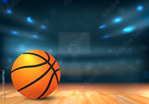 Basketball ball in sport arena with tribunes and lights