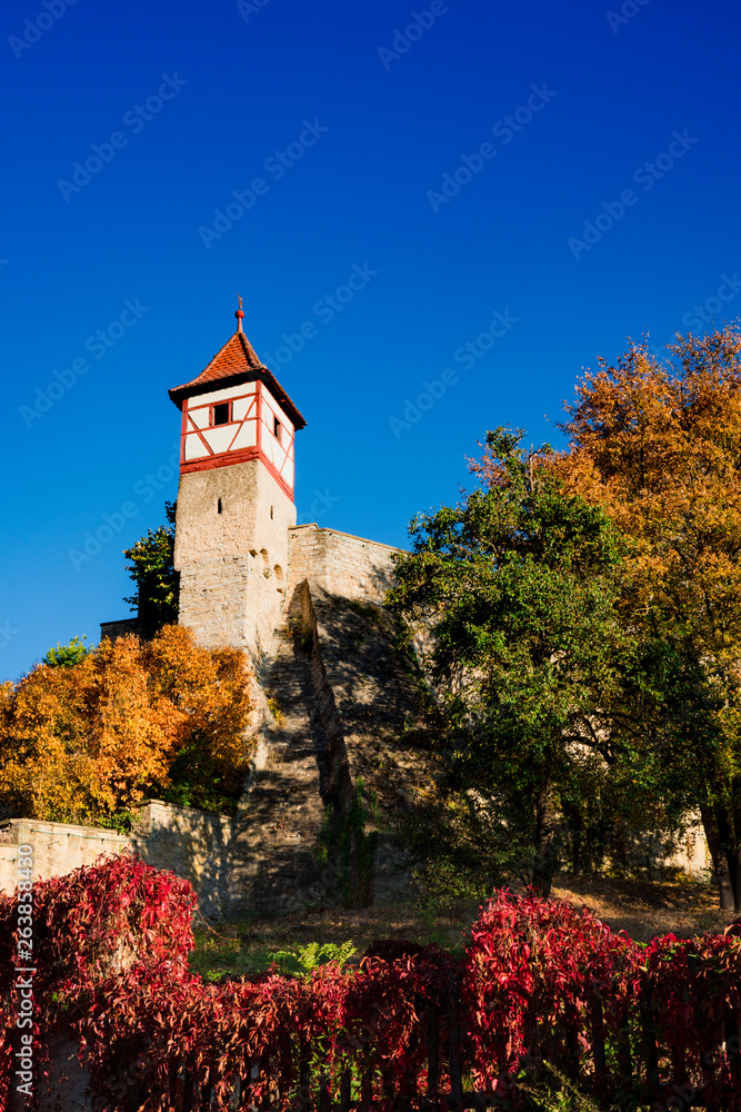 tower of city wall, in autumn colors, Bad Wimpfen, Germany. Blue sky, space for text