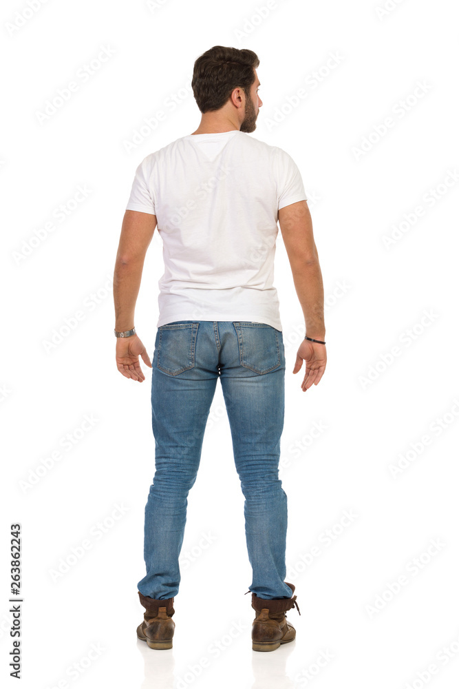 Rear View Of Standing Man In Jeans And WhiteT-shirt Rear View Of Standing Man In Jeans And WhiteT-shirt