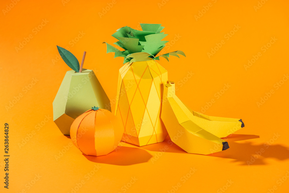 handmade paper pineapple, bananas, pear and tangerine on orange - obrazy, fototapety, plakaty 