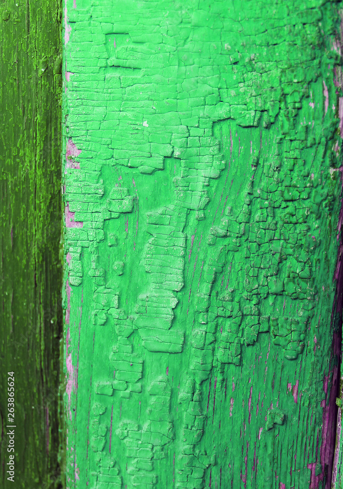 Fototapeta premium Old wooden background with remains of pieces of scraps of old paint on wood. Texture of an old tree, vintage wood background peeling paint. old blue board with cracked paint