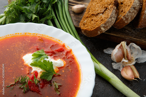 Vegetable soup with beets, rustic style, selective focus