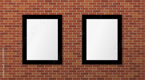 Two black frames on a brick wall. Vector mock up