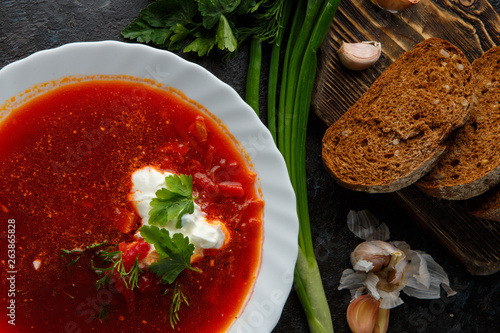 Traditional Ukrainian Russian borscht with white beans on the bowl. Flat lay. Top view