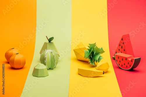 Fototapeta Naklejka Na Ścianę i Meble -  various handmade paper fruits on stripes of colorful paper