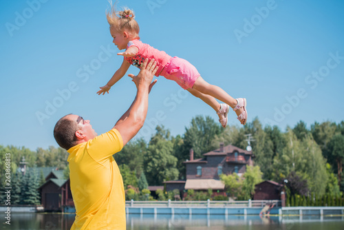 Concept of children life. Little child having fun in a beach. Happy child playing in the nature . Kid having fun outdoors. Summer vacation and healthy lifestyle 