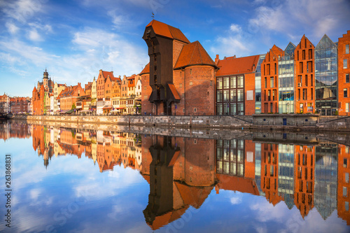 Old town of Gdansk reflected in the Motlawa river at sunrise, Poland.