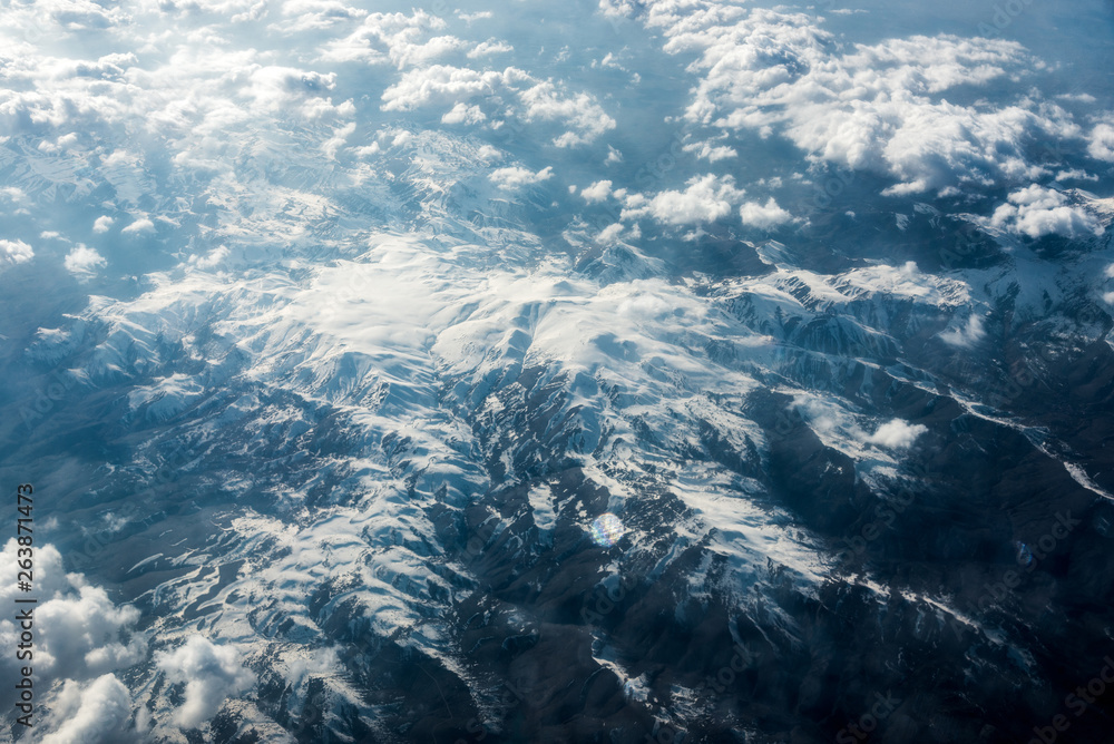 Top view of white clouds above the ground or water Top view of white clouds above the ground or water