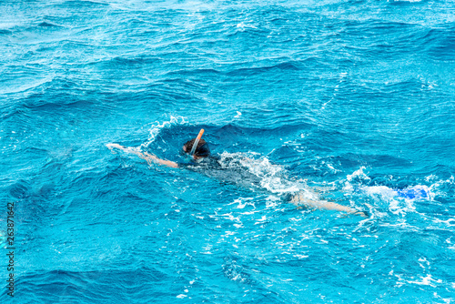 Leisure and sports, guy or man snorkeling in the blue sea