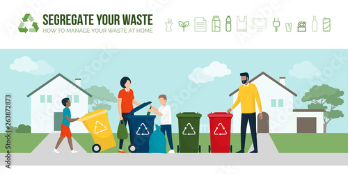 Happy family sorting waste and recycling