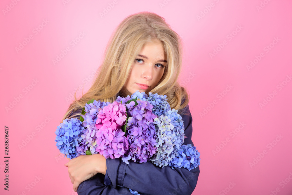Gentle delicate flower. Pure beauty. Tenderness of young skin. Springtime bloom. Simple beauty. Girl cute blonde hug hydrangea flowers bouquet. Natural beauty concept. Skin care and beauty treatment
