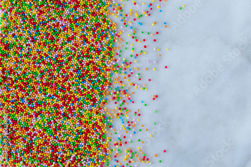 Sprinkles, hundreds and thousands on a marble base