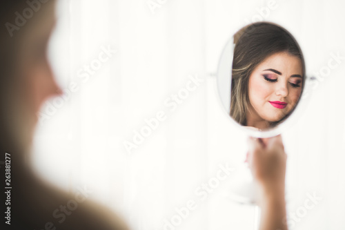 Free Download Gorgeous bride in robe posing and preparing for the wedding ceremony face in a room - GFXLoad