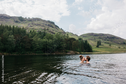Couple kissing in the lake