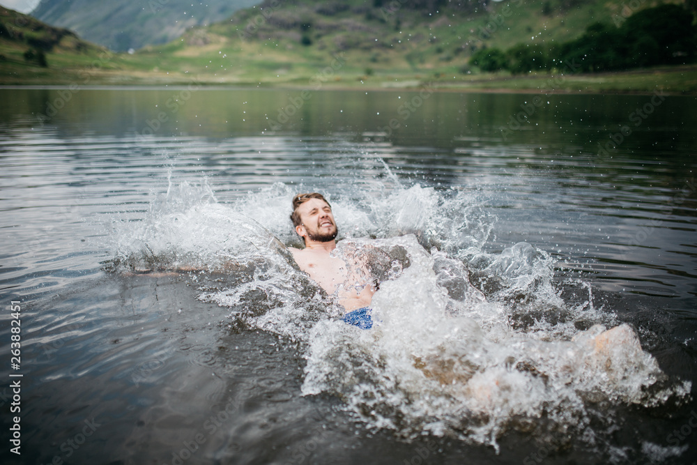 Fototapeta premium Man falling into cold water