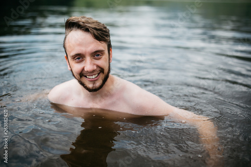 Man swimming in water