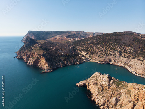 Aerial view of rocky mountain coastline and sea harbor, summer travel destinations concept