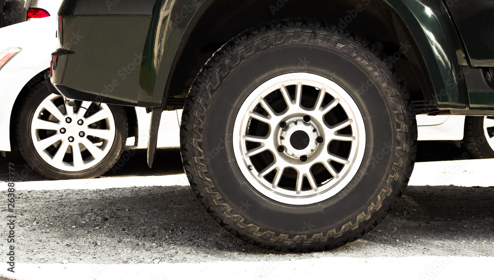 All-season tire on wheel rim for crossovers and off road vehicles