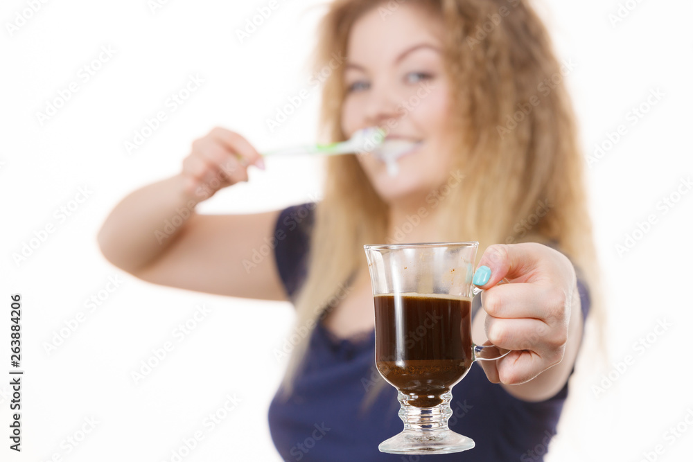 Happy woman holding toothbrush and coffee Happy woman holding toothbrush and coffee