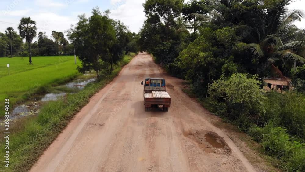 Traditional Rural Cambodia, Aerial View Truck on Dirt Road. Traditional Rural Cambodia, Aerial View Truck on Dirt Road.
