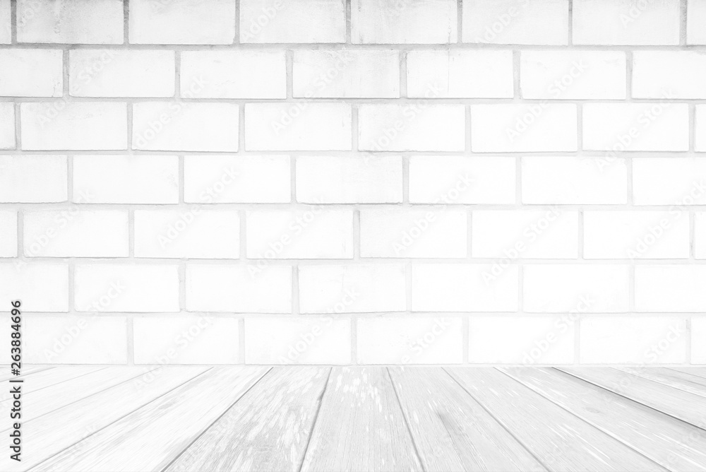 White Wood Table with Brick Wall Background.