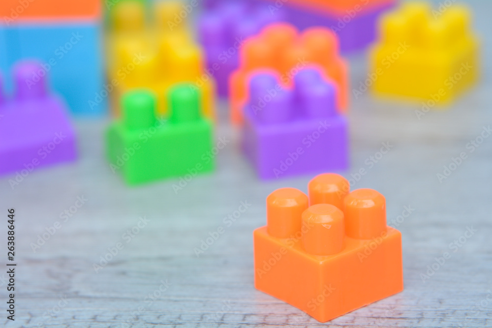 Colorful plastic block on table Colorful plastic block on table