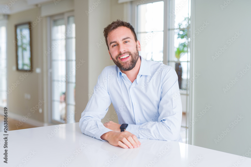 Handsome business man smiling positive at the camera Handsome business man smiling positive at the camera
