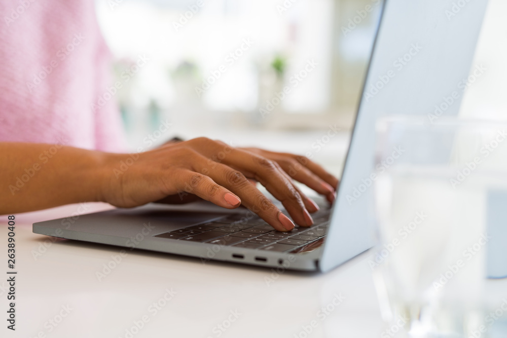 Close up of young woman working typing using laptop Close up of young woman working typing using laptop