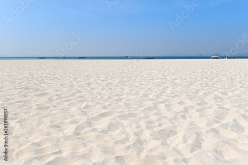 Sand on the beach and blue sky as background