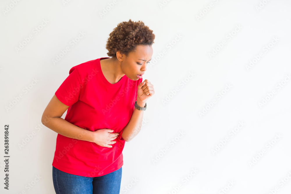 Young beautiful african american woman over white background feeling unwell and coughing as symptom for cold or bronchitis. Healthcare concept. Young beautiful african american woman over white background feeling unwell and coughing as symptom for cold or bronchitis. Healthcare concept.