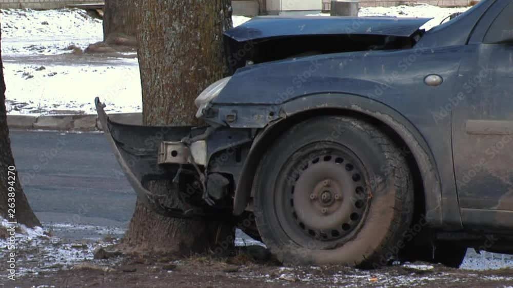 The Car Got Into a Skid and Crashed Into a Tree. Car Crash Accident on Street, Damaged Automobile After Collision. Detail With Damage Automobile After a Car Crash Accident. The Car Got Into a Skid and Crashed Into a Tree. Car Crash Accident on Street, Damaged Automobile After Collision. Detail With Damage Automobile After a Car Crash Accident.