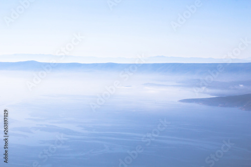 Dalmatia, Croatia, in blue sea and misty fog