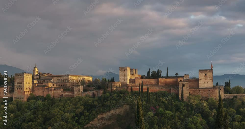 Sunset with the Alhambra of Granada as main subject. Beautiful clouds and Sierra Nevada in the background. Sunset with the Alhambra of Granada as main subject. Beautiful clouds and Sierra Nevada in the background.