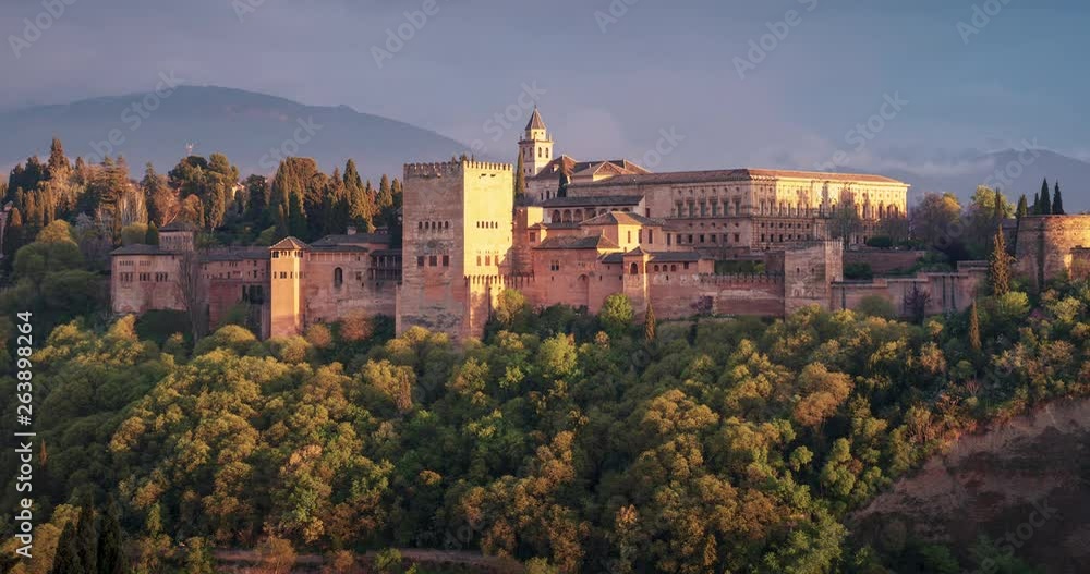 Sunset with the Alhambra of Granada as main subject. Beautiful clouds and Sierra Nevada in the background. Sunset with the Alhambra of Granada as main subject. Beautiful clouds and Sierra Nevada in the background.