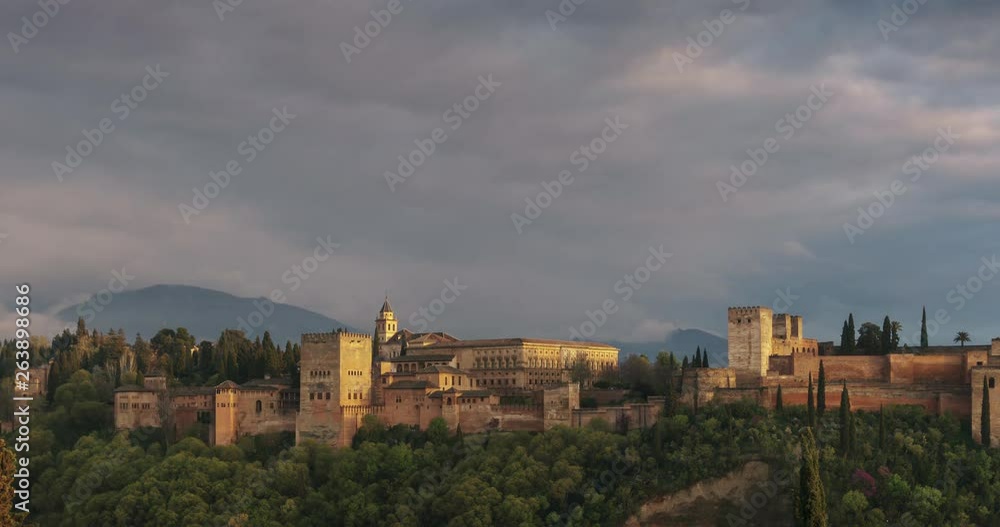 Sunset with the Alhambra of Granada as main subject. Beautiful clouds and Sierra Nevada in the background. Sunset with the Alhambra of Granada as main subject. Beautiful clouds and Sierra Nevada in the background.