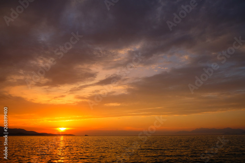View of the sunset over Greece from Albania. The Ionian Sea. © badahos