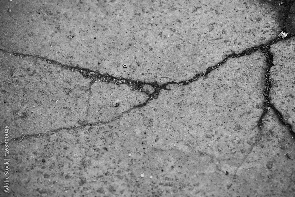 Obraz premium The concrete texture, wall, with cracks and scratches can be used as a background, web banner with space for text