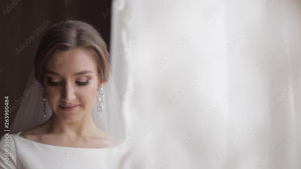 Elegant bride walkin though the room in her wedding day, She waiting for groom Elegant bride walkin though the room in her wedding day, She waiting for groom