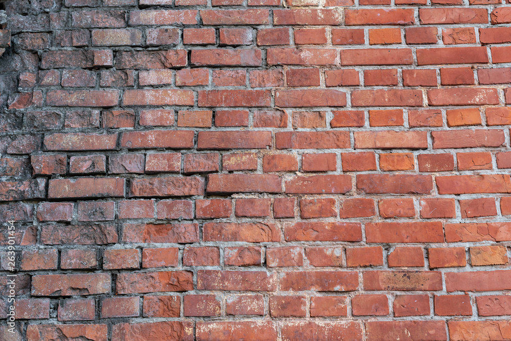 Obraz premium The brick texture, wall, with cracks and scratches can be used as a background