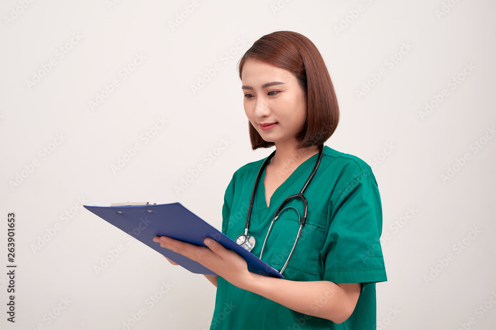 Asian nurse woman with a folder , isolated on white background Asian nurse woman with a folder , isolated on white background