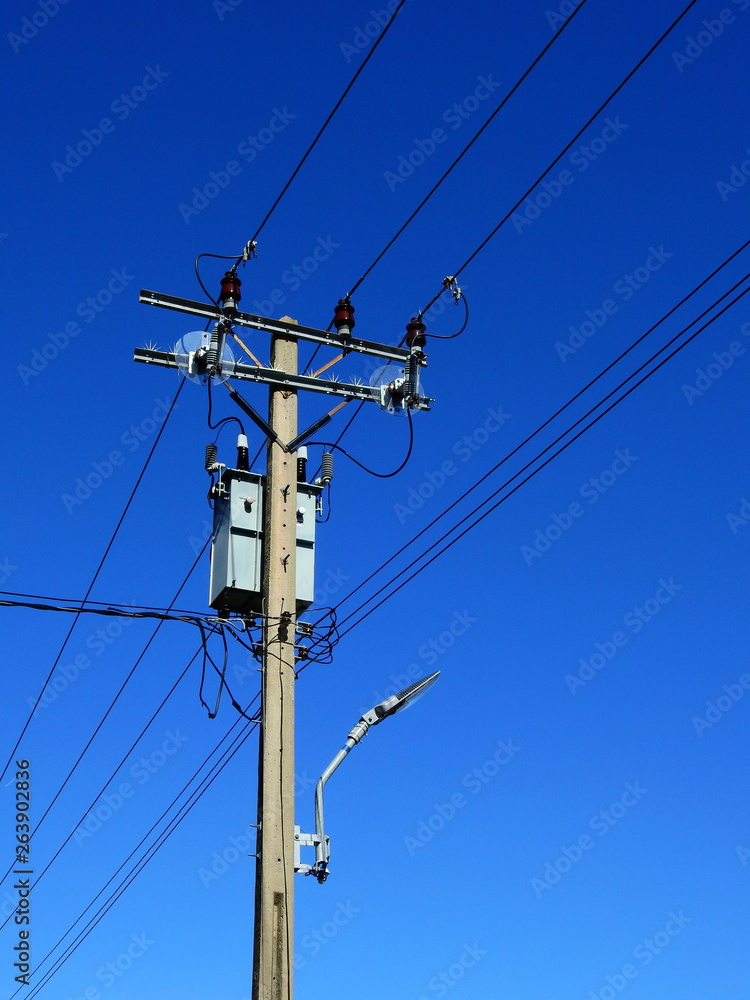 electric pole and electric transformer with blue sky electric pole and electric transformer with blue sky