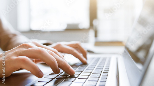 Website technical content writer. Network service. Social media blogging. Closeup of hands typing on laptop, creating new article. photo