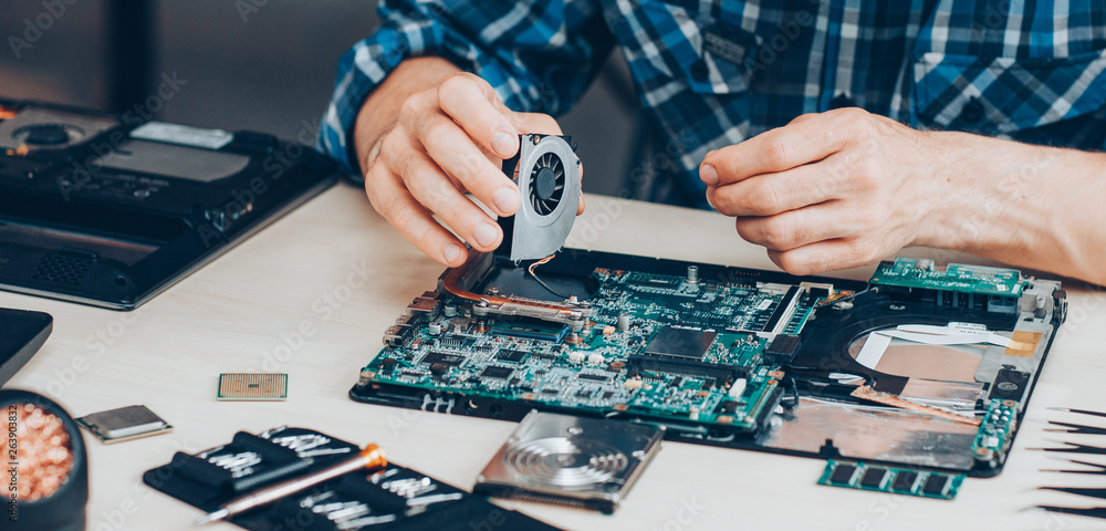 Computer repair service. Hardware support. Electronic technology. Cropped  shot of technician fixing laptop cooler. Photos | Adobe Stock