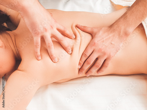 Alternative medicine. Chiropractic treatment. Manual manipulation. Health care professional using spinal adjustments.