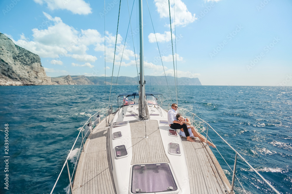 A Just married couple on yacht. Happy bride and groom on their wedding day A Just married couple on yacht. Happy bride and groom on their wedding day